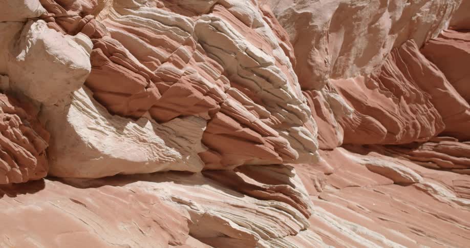 A large rock formation in the badlands during the day