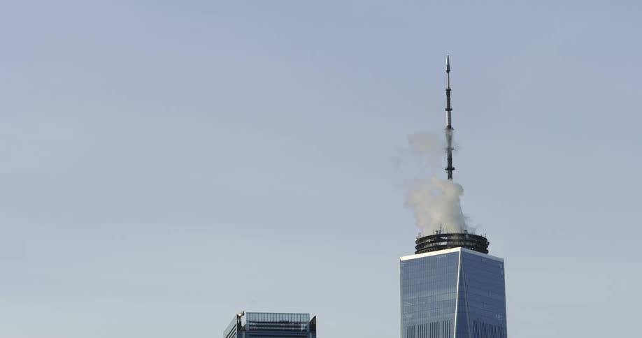 Smoke rises from the top of a tower