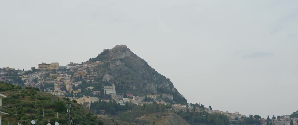 A town is sitting on a hillside