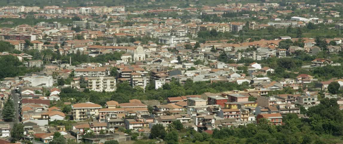 Aerial view of a town with some trees around homes