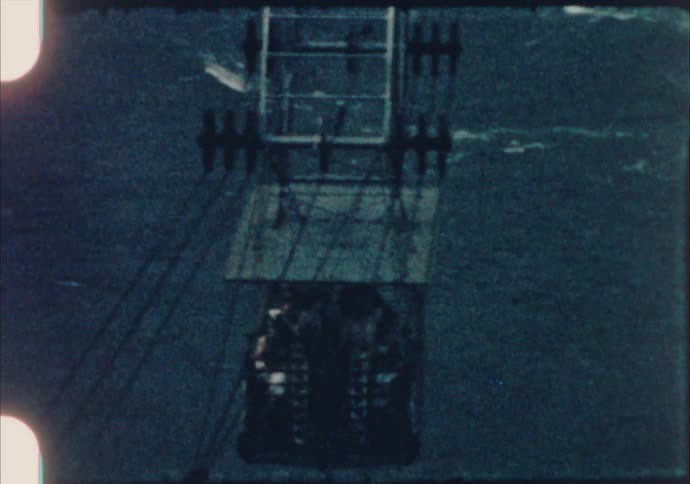 A view of a ski lift over some water
