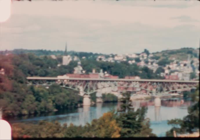 The Kennebec river flows through the city of Augusta Maine in the 1960's