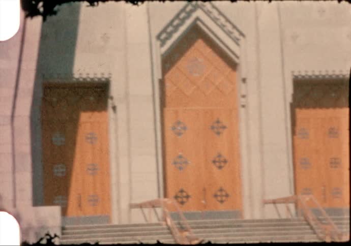 Vintage film of the facace of the bulding hosting the exposition dhistoire mariale in canada