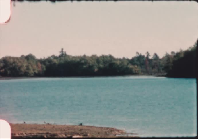 A lake with trees on the surrounding banks