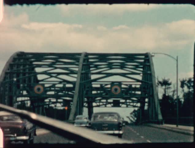 A view of cars driving over a bridge