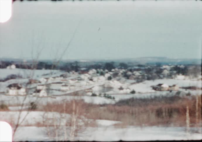 Snow blankets a small university town in Maine in the 1950's