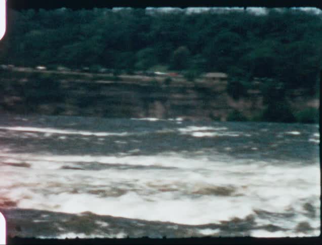Vacation footage of a the rapids on a river caught on vintage film