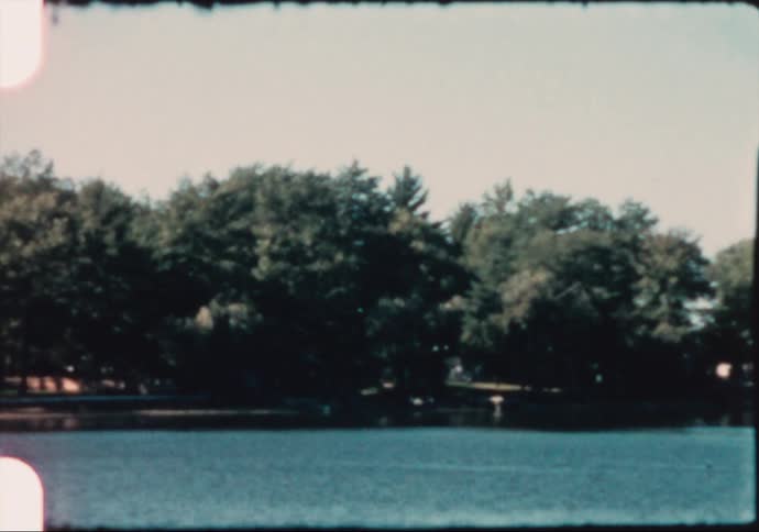 Houses on the coast of a river caught on vintage film