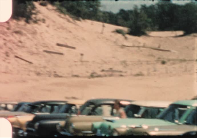 A view of a parking lot full of cars