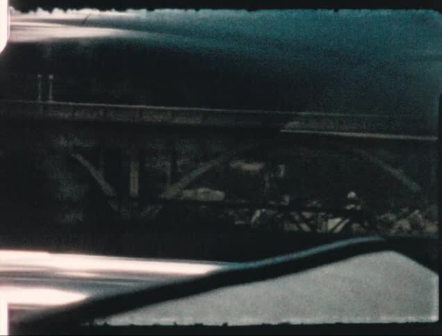 Traveling past a bridge and hills