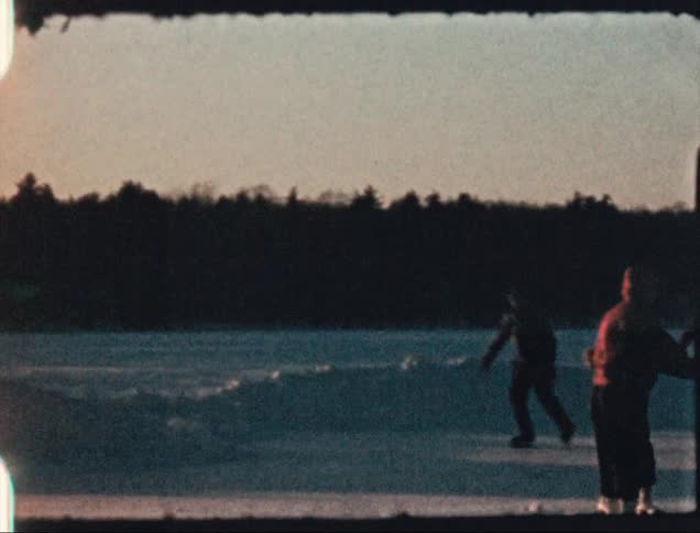 Children ice skating in winter during the 1950s