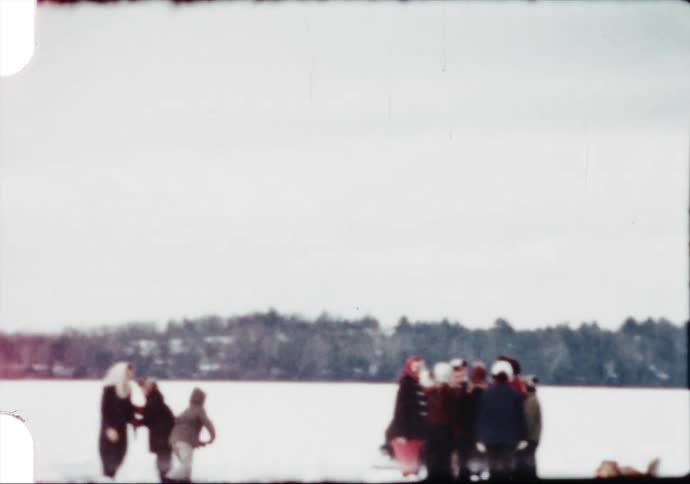 People gather together during winter on a frozen lake in a festive vintage scene