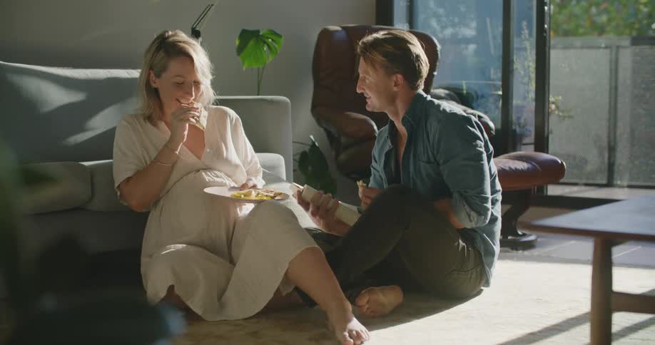 A man and woman talking to each other and laughing