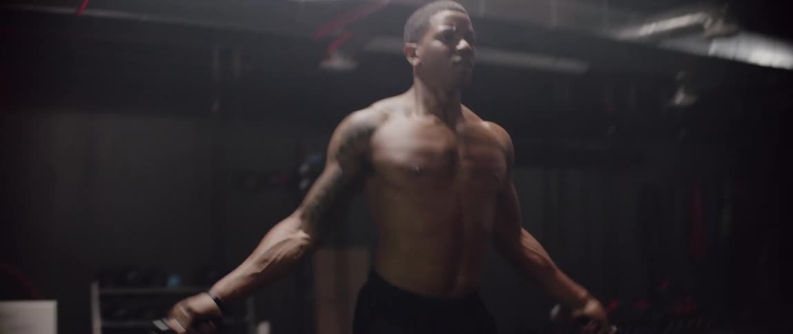 A man jumps rope in a gym