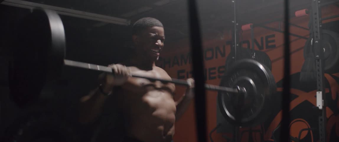 Man lifting weights in a gym