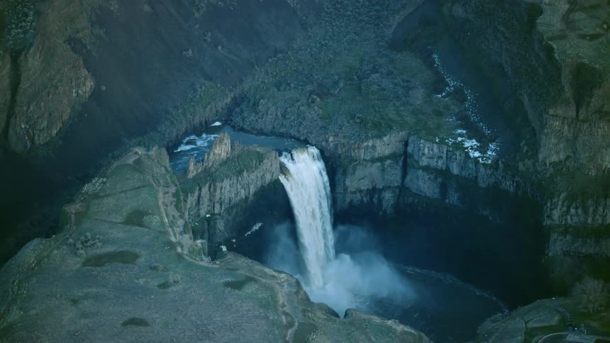 200 feet high Palouse Falls in Eastern Washington as the Palouse river cascades to the pool below in this high altitude aerial shot