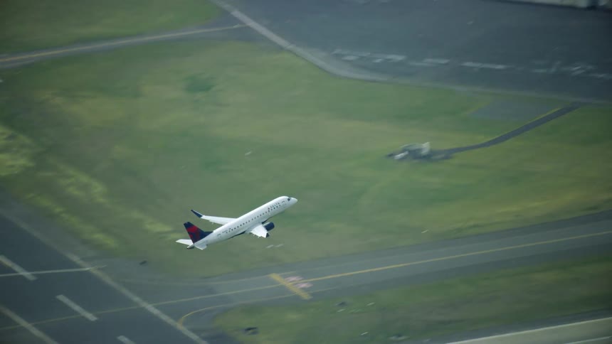 A Commercial Airbus A319 passenger commercial aircraft departs a major airport performing a non stop flight across the United States