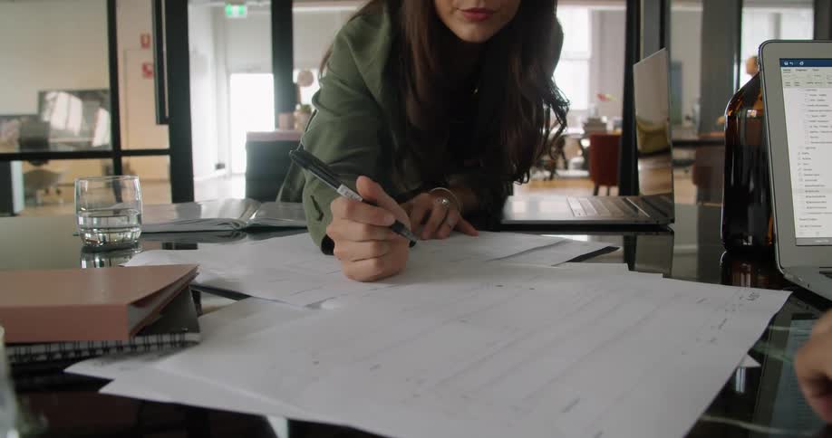 A woman is working in an office during the day