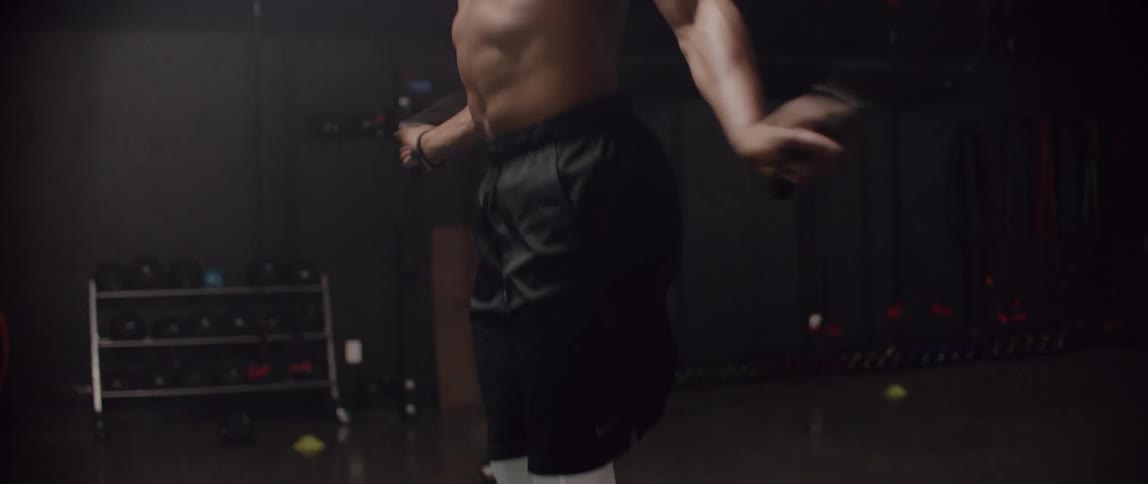 Man jumping rope in a gym