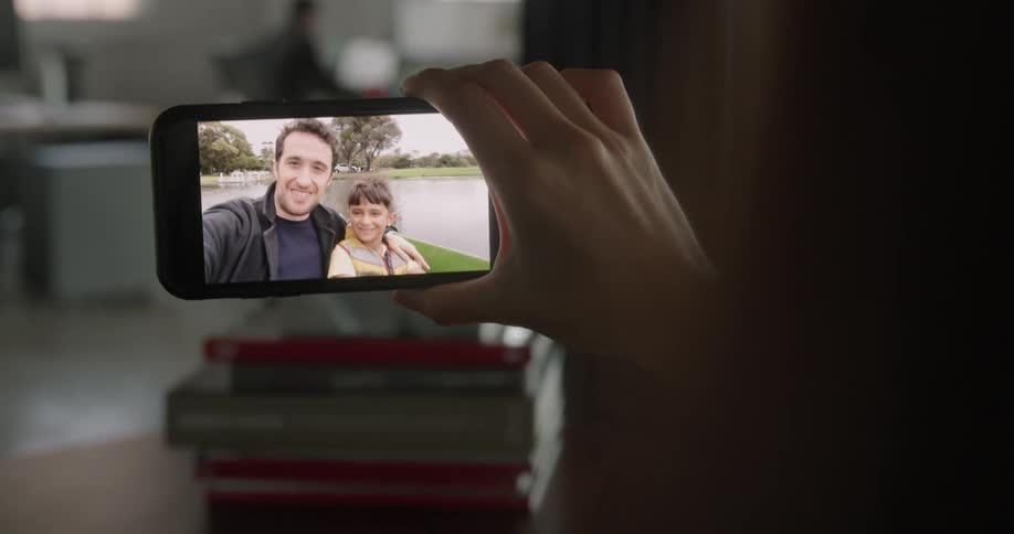 People are talking on the cell phone with video