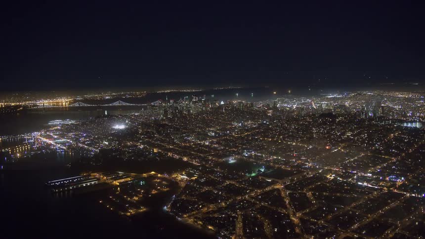 An aerial view of a city skyline off the water