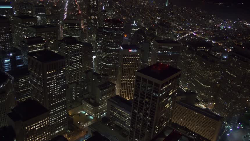 An aerial view of office buildings and high rises in a downtown area