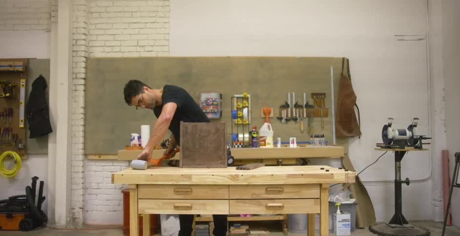Craftsman working on a project in a woodshop