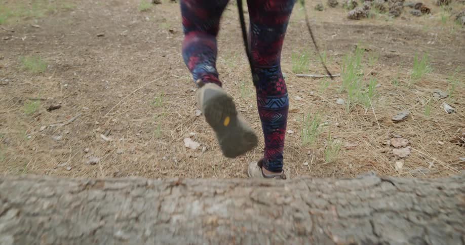A woman hiking out in a field