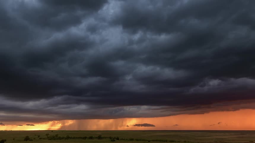 Lightning and storm clouds over a field