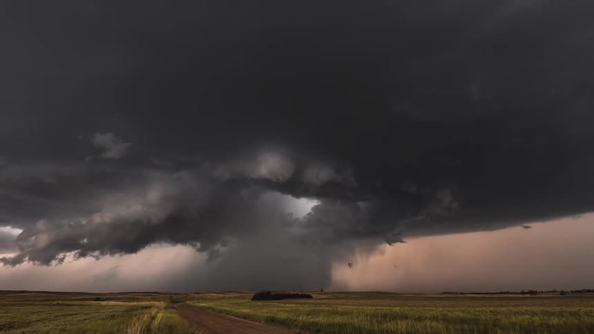 Time lapse of a powerful tornado sweeping through the countryside
