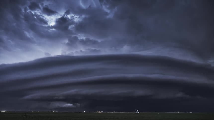 Lightning and storm clouds over a field