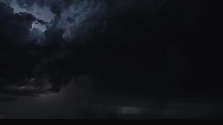 Time lapse of thunder cloud and lighting sweeping across the countryside