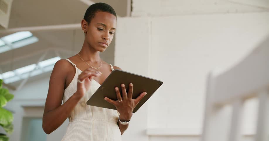 Woman working on a tablet in the office