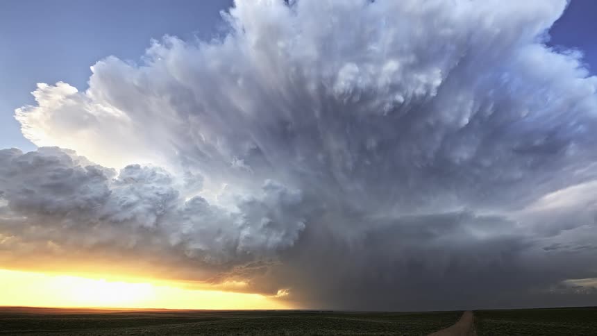 Time lapse of a large thunderstorm sweeping across the countryside at sunrise