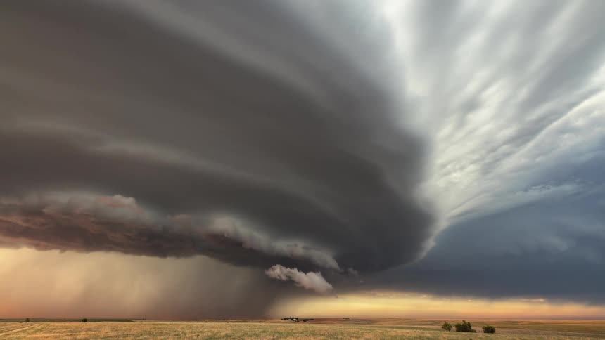 A large storm moves over the field