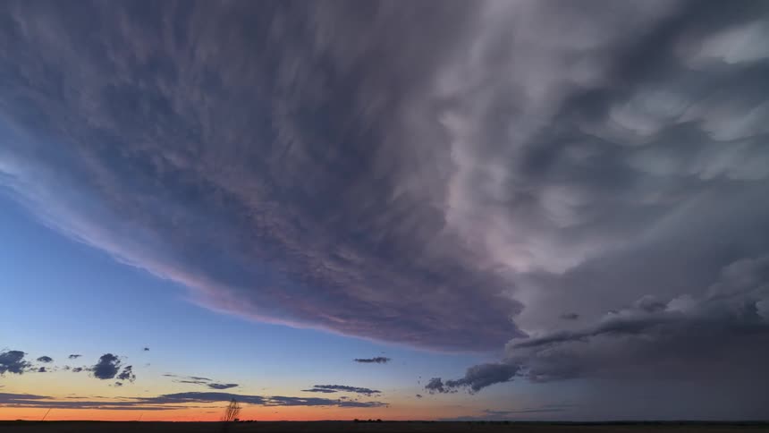 Lightning flashes as dark storm clouds move across the sky