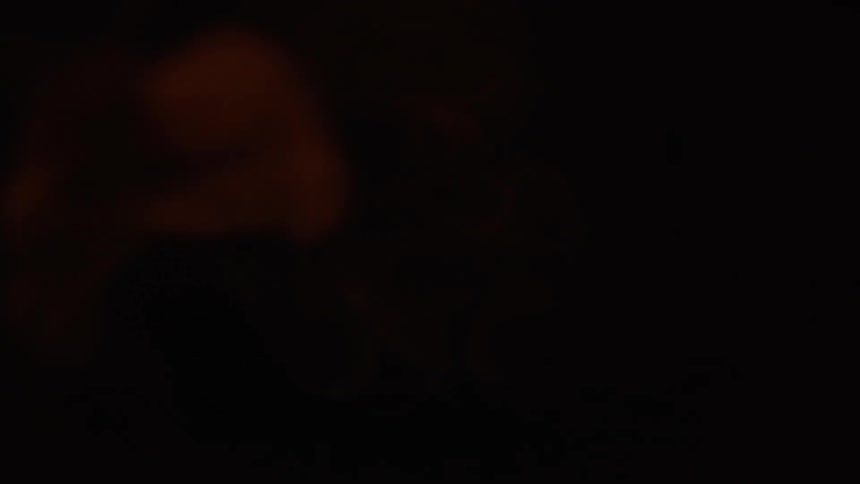 A pov view of an exploding flame coming up a tube towards camera