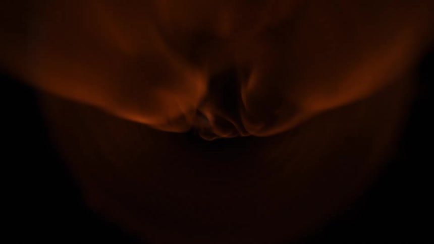 Orange flams race down dark tube with the camera