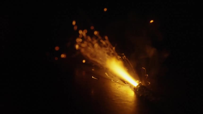 sparks fly out of a fuse burning