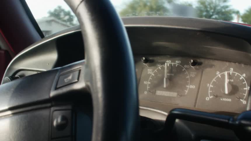 Gauges on a vehicles dashboard as it drives