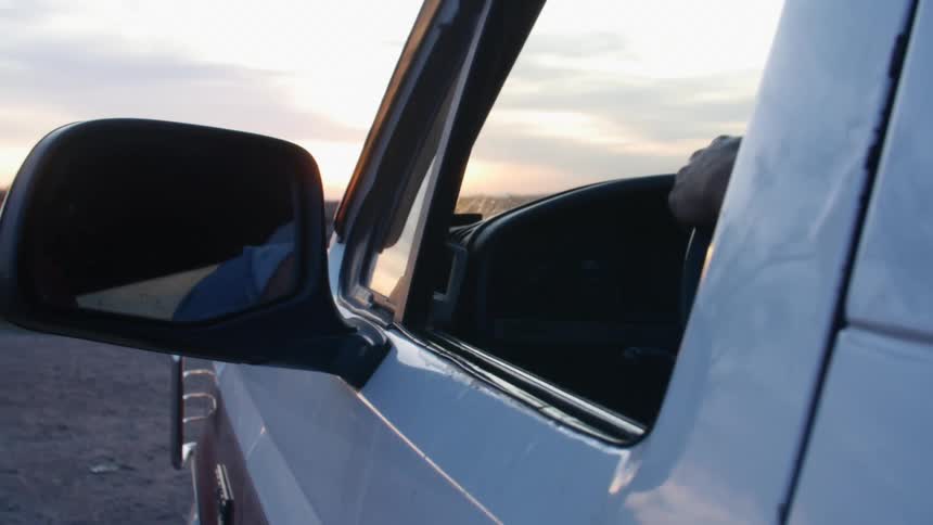 A person is driving a car offroad
