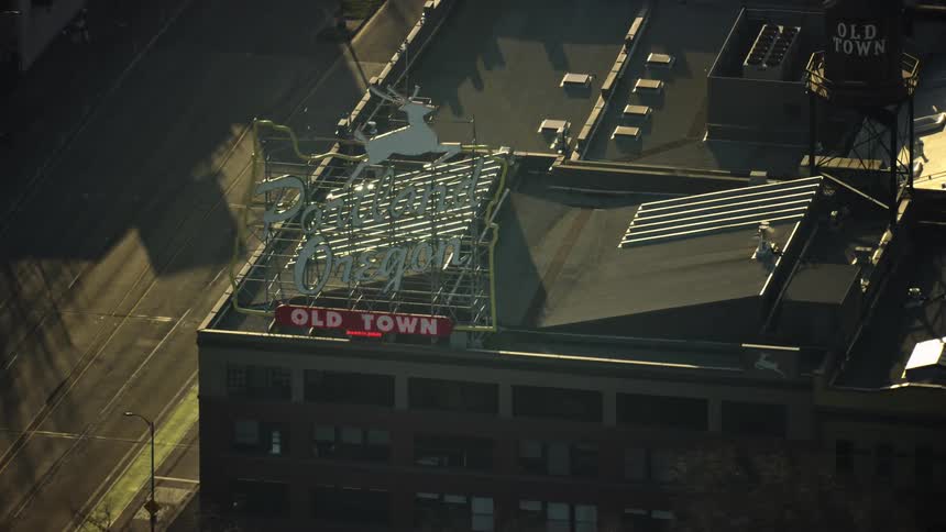 Daytime aerial of the Portland Oregon White Stag Sign as seen from high above the city in this tight shot aerial