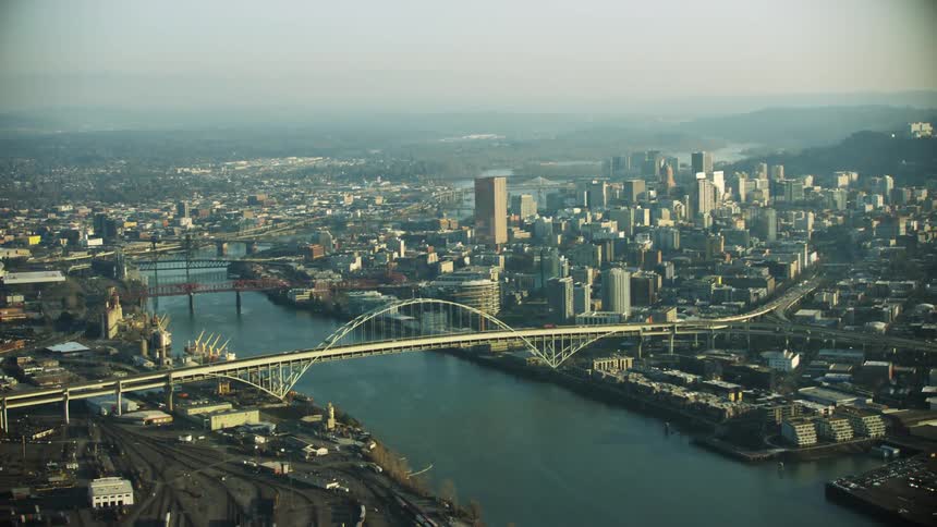 The Fremont Bridge across the Willamette River in Portland in the U.S. state of Oregon looking north towards the downtown grid of the city and skyscrapers