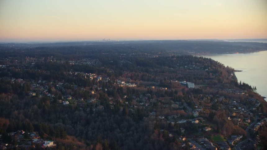 Flying over Lynwood and the Puget Sound looking south at downtown Seattle on the far horizon as the sunsets on a clear crisp day