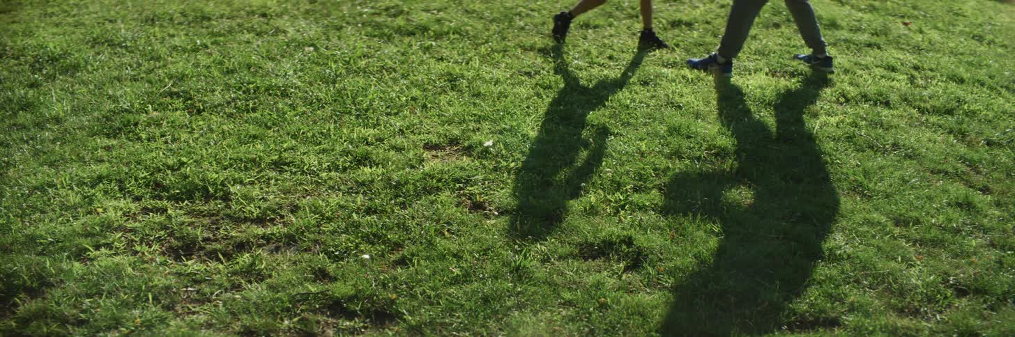 The shadows of a child boxing with an adult