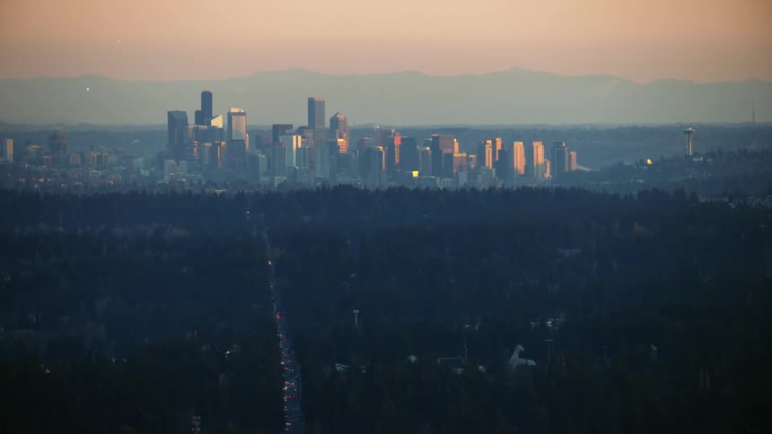 Awesome aerial of downtown Seattle at sunset as Aurora Avenue leads straight towards the city center
