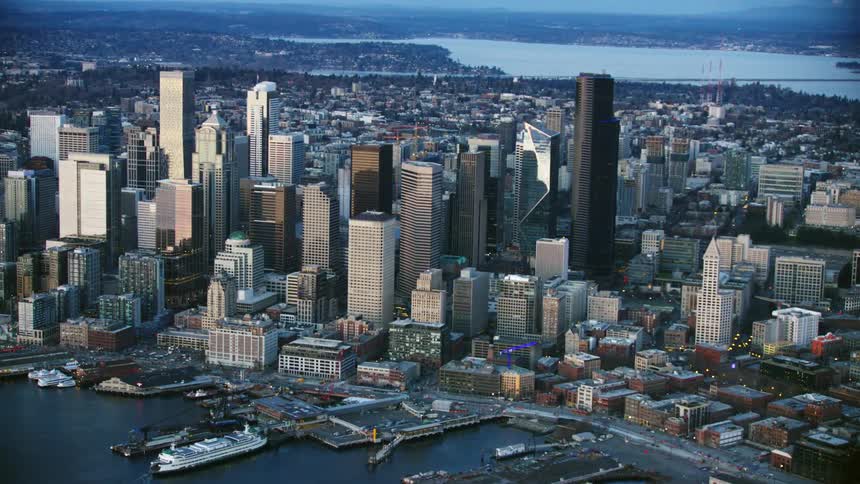 Beautiful Aerial of Downtown Seattle looking Northeast across the skyscrapers and Lake Washington in the background