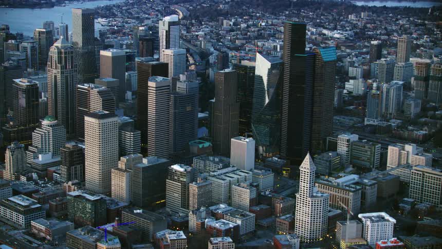 Blue hour aerial of downtown Seattle just as the sun has set on a clear night in this large Pacific Northwest city