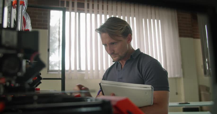 A man is working at his desk