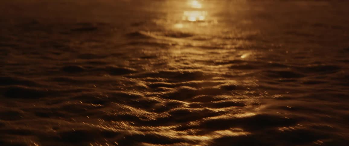 An ocean with waves of water with the sky and clouds in the background